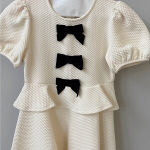 Janie and Jack Cream Peplum Dress with Black Bow Details